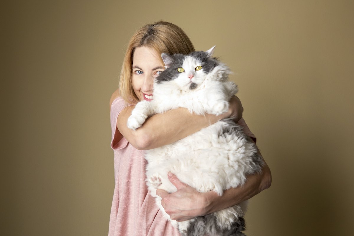 Woman Holding Large Furry Cat