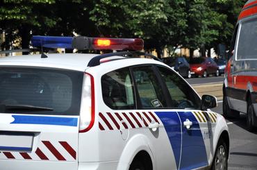 Police car and ambulance at scene of a traffic accident
